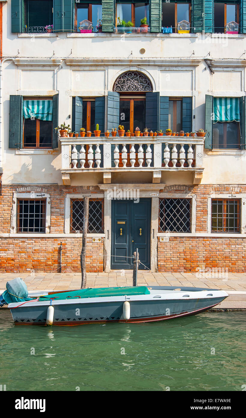 Motor boar moored along a canal in Venice, Italy Stock Photo