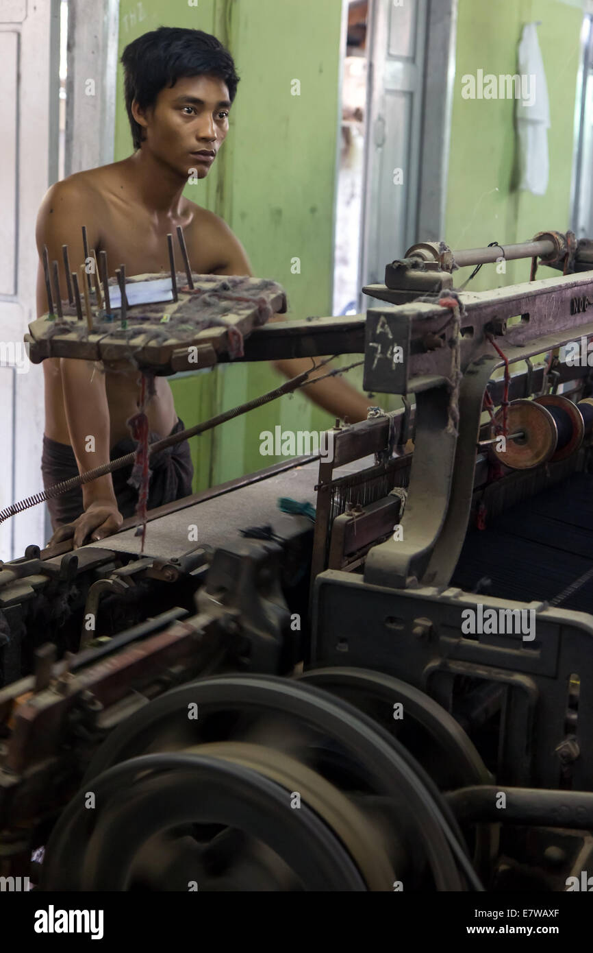 man working at a textile machine Stock Photo