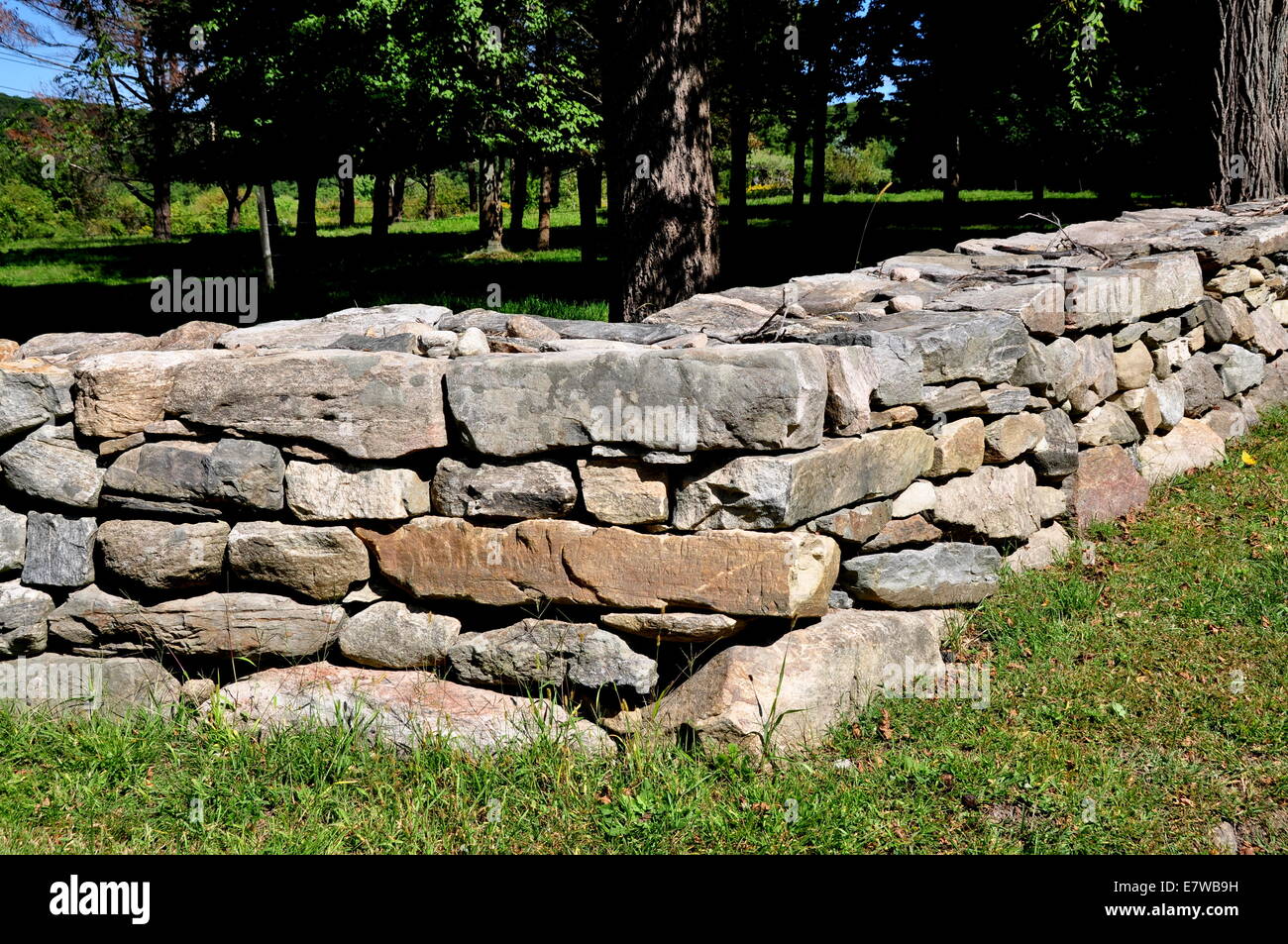 New Preston, Connecticut:  A traditional New England stone wall separates private lands Stock Photo