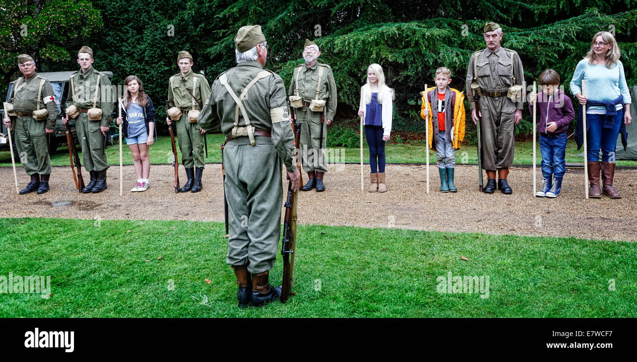 Civil Defenders Home Guard Living History Group run an educational session for children & parents at a 1940s revival event Stock Photo