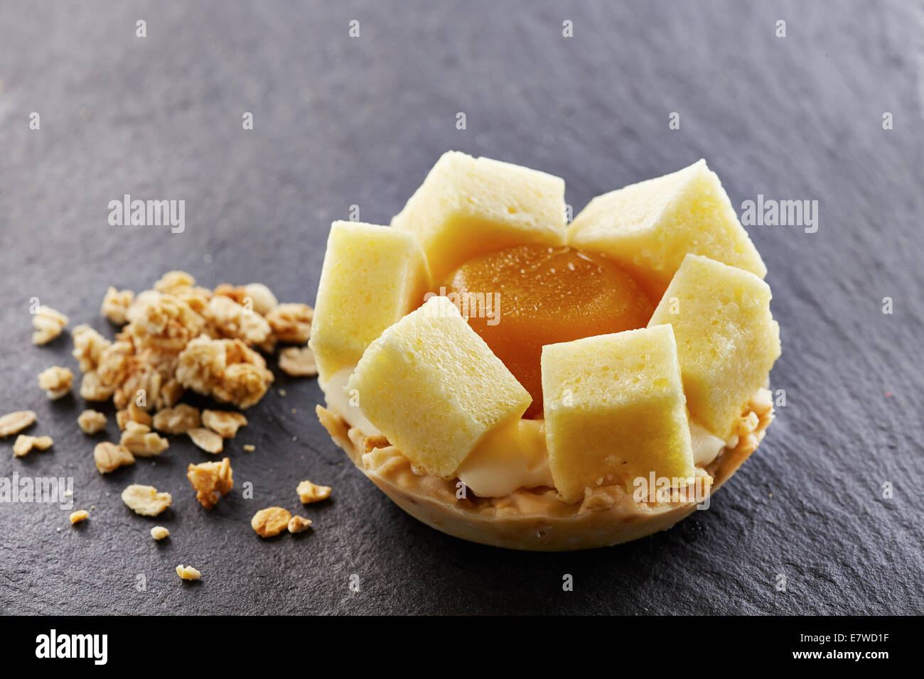 Exotic fruits individual muesli tart Stock Photo - Alamy