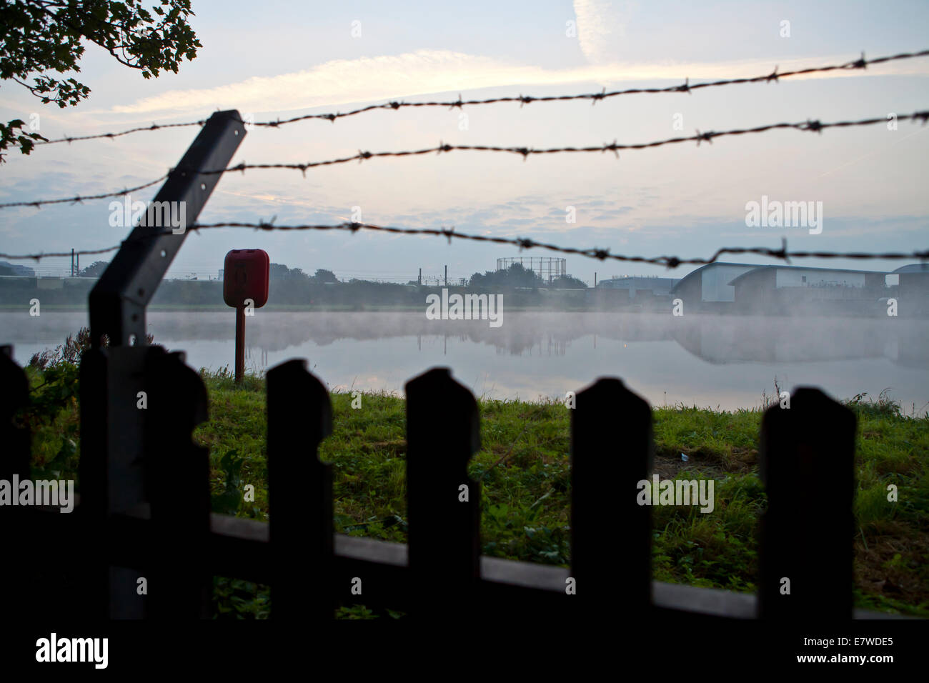 Empty gasometer and water reservoir Stock Photo - Alamy