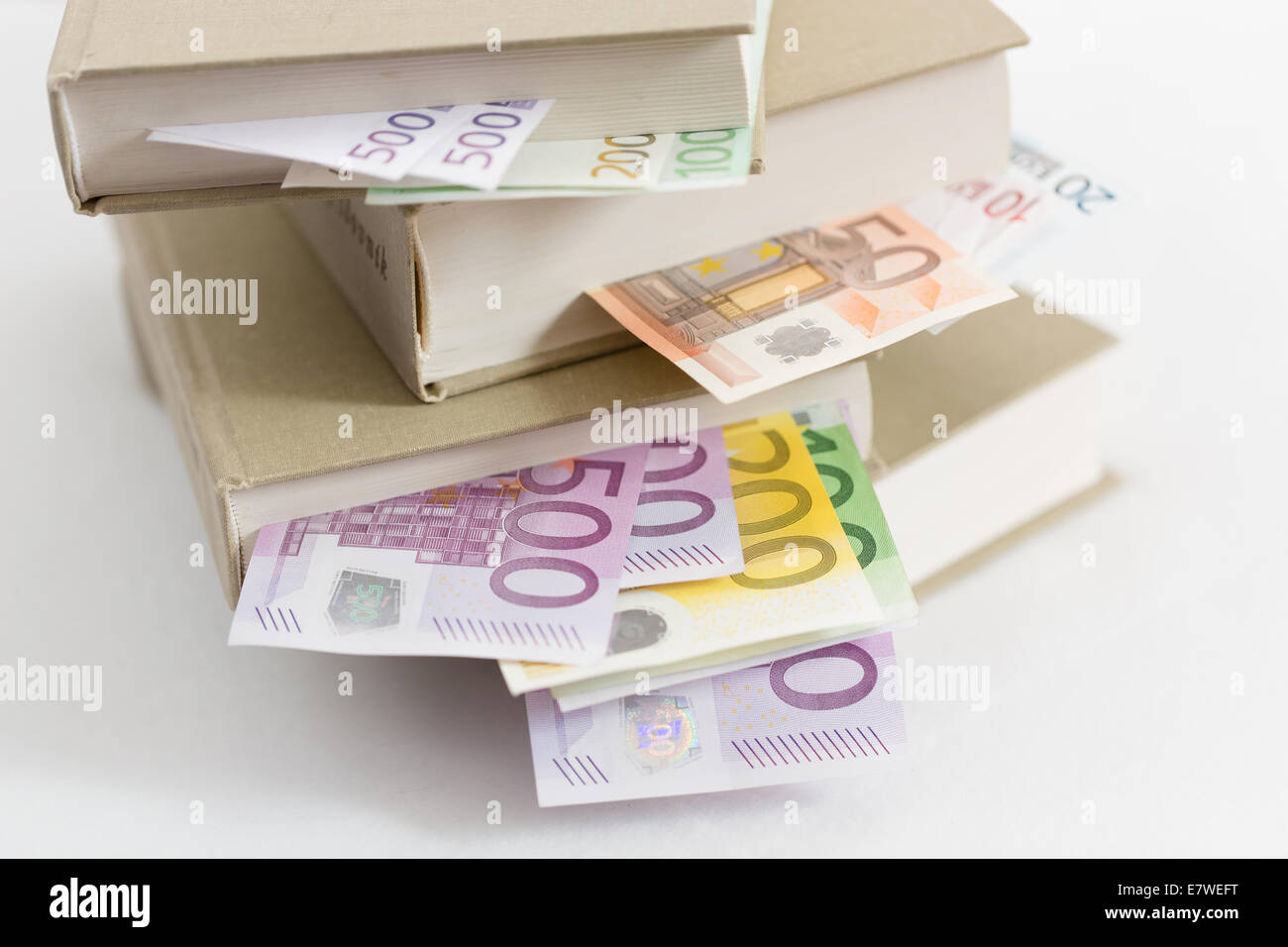 books with EUR banknotes inside Stock Photo