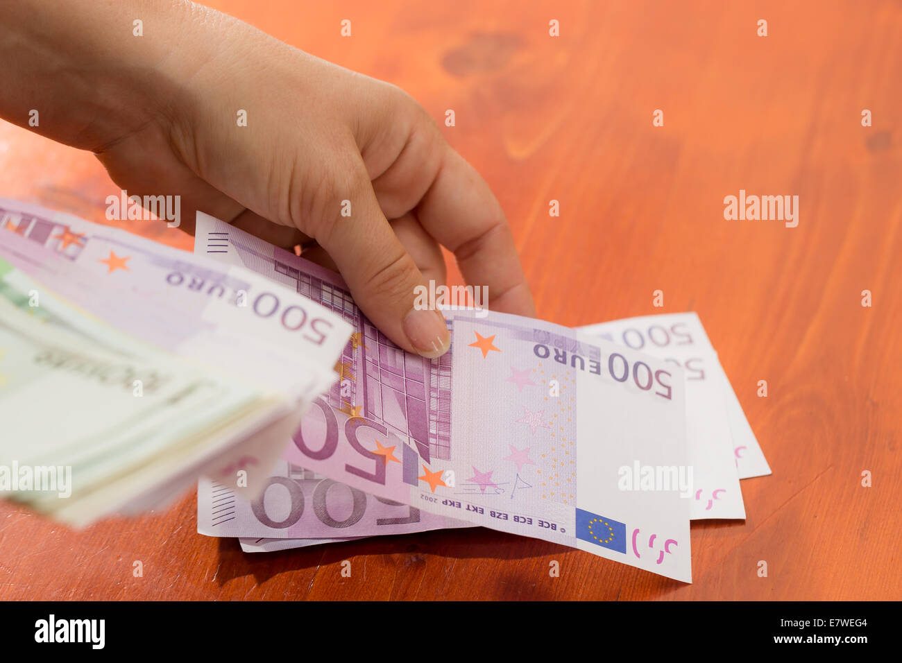 woman counting EUR banknotes Stock Photo