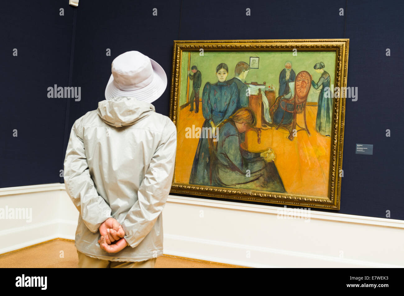 Visitor gazing at Edvard Munch´s 'Death in the Sick-Room' at the National Gallery of Oslo, Norway Stock Photo