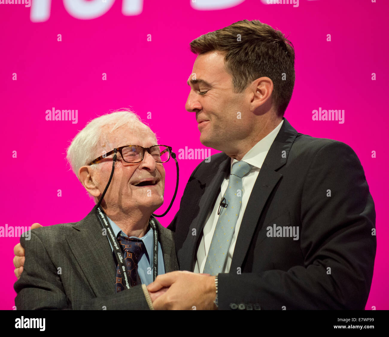 Manchester, UK. 24th September, 2014. 91-year-old campaigner Harry Smith is greeted by Shadow Secretary of State for Health Andy Burnham after his address to the auditorium on day four of the Labour Party's Annual Conference taking place at Manchester Central Convention Complex Credit:  Russell Hart/Alamy Live News. Stock Photo