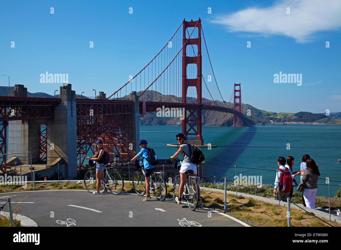 Cyclists on bike trail and Golden Gate Bridge, San Francisco Bay, San Francisco, California, USA Stock Photo