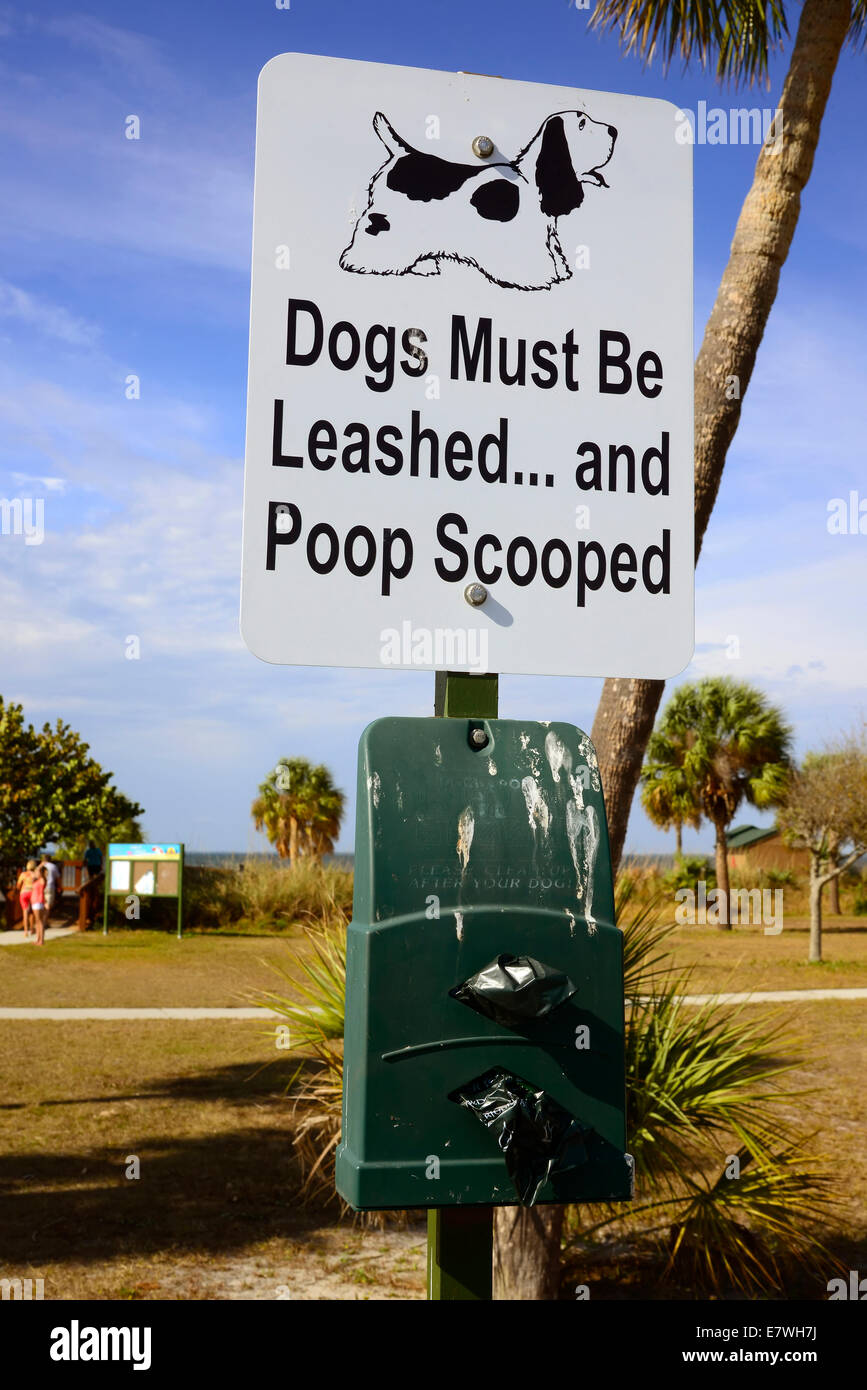 Pet waste station and leashed dog sign Stock Photo Alamy