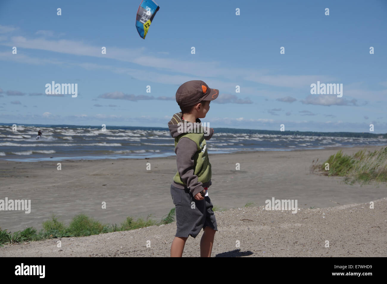 A kid is showing a kite surfer Lake Huron, bay Stock Photo