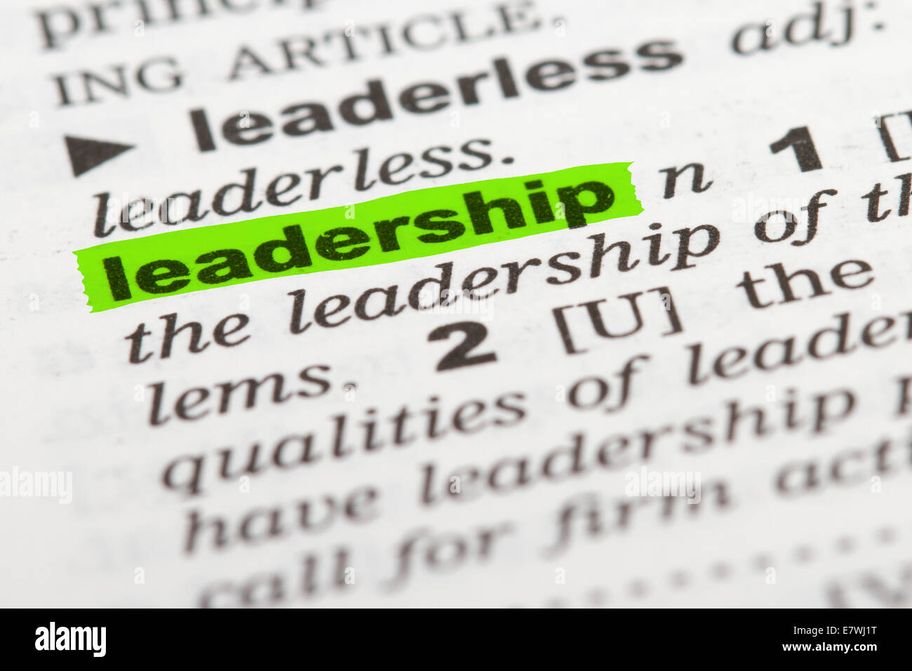 Leadership word highlighted with green marker on dictionary page Stock