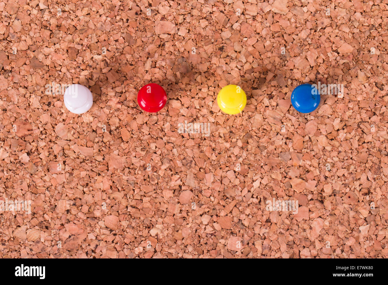 Push pins on cork bulletin board Stock Photo Alamy