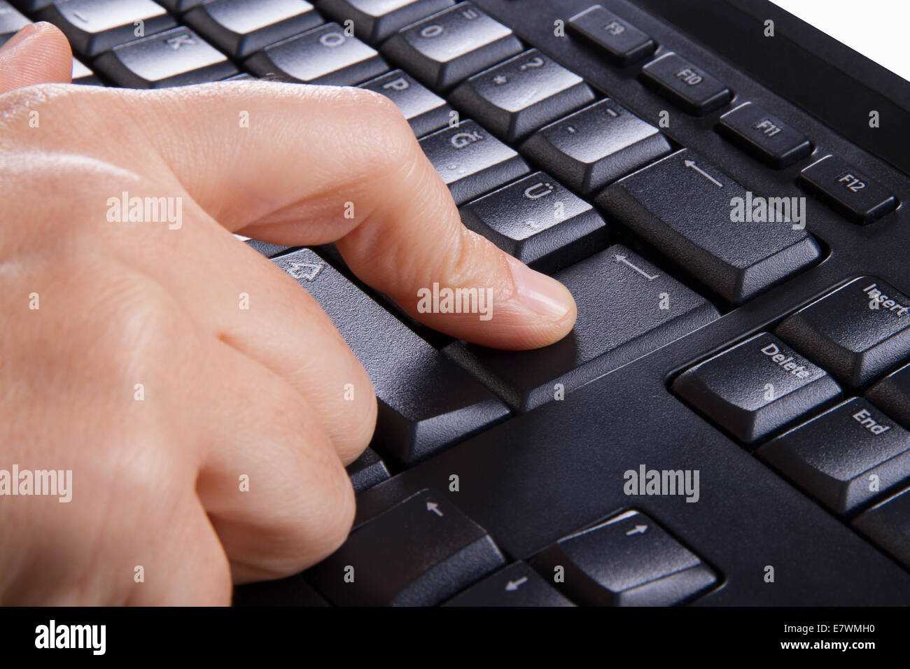 Index finger pressing enter key, button on keyboard Stock Photo Alamy