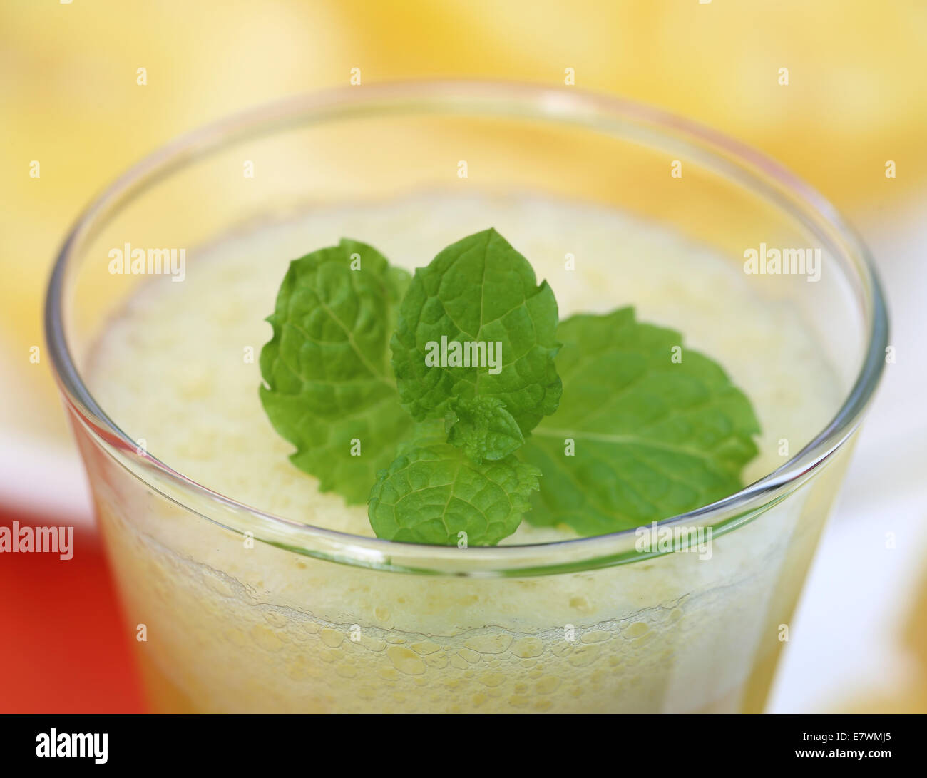 Pineapple Juice in glass with mint leaves Stock Photo