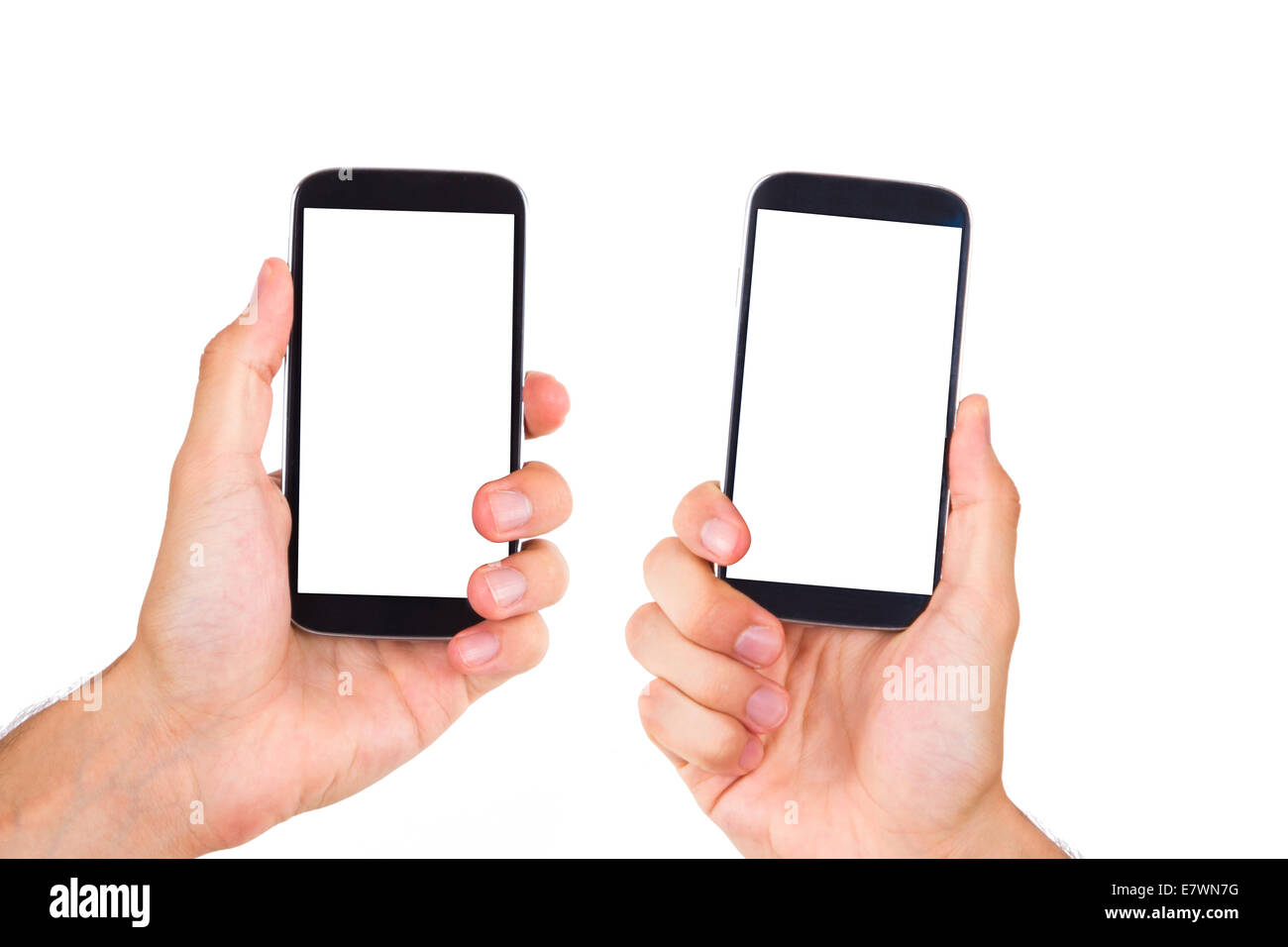 Pair of hands holding and showing mobile phones with blank, white ...