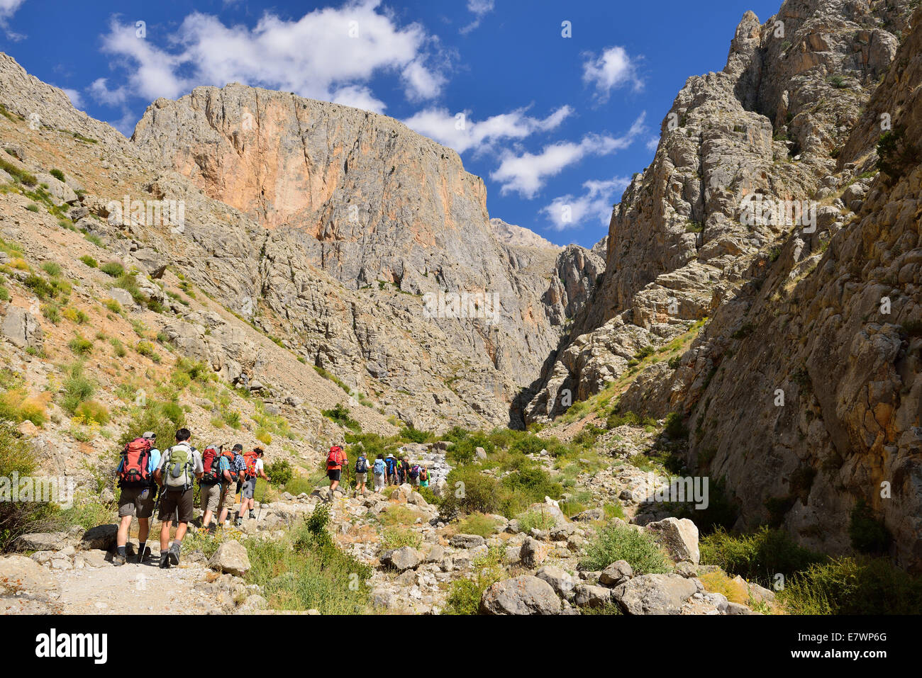 Group of people hiking in Cimbar Canyon, Aladaglar National Park, High or Anti-Taurus Mountains, Turkey Stock Photo