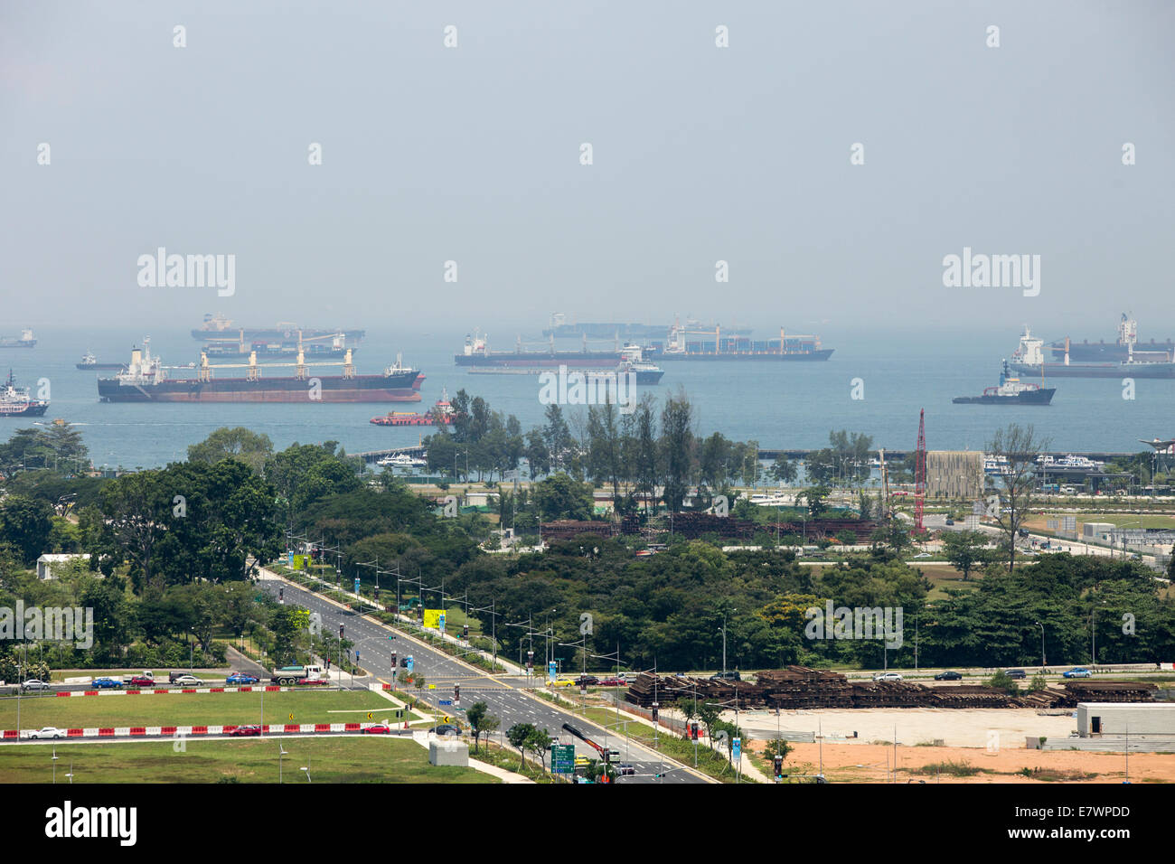 Ships are seen anchored off the  coast of Singapore. Stock Photo