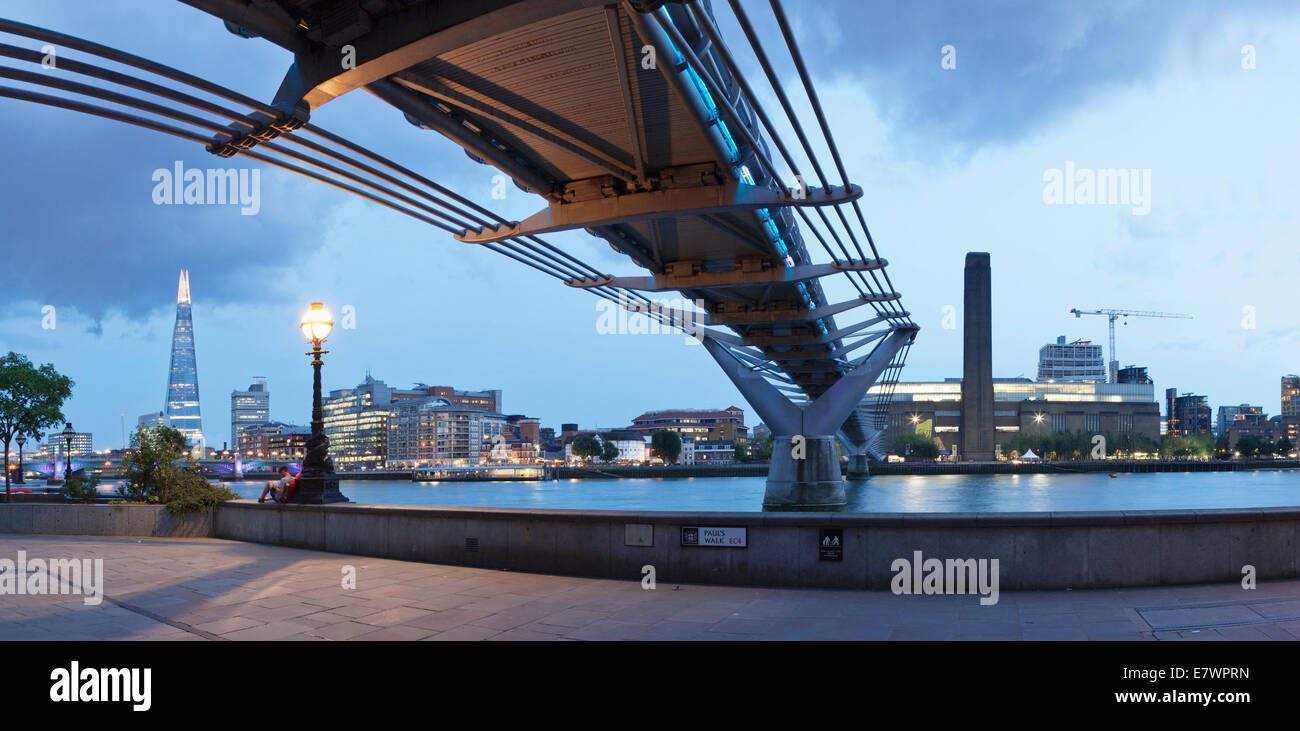 Millennium Bridge from below with views of The Shard skyscraper and Tate Modern, River Thames, London, England, United Kingdom Stock Photo