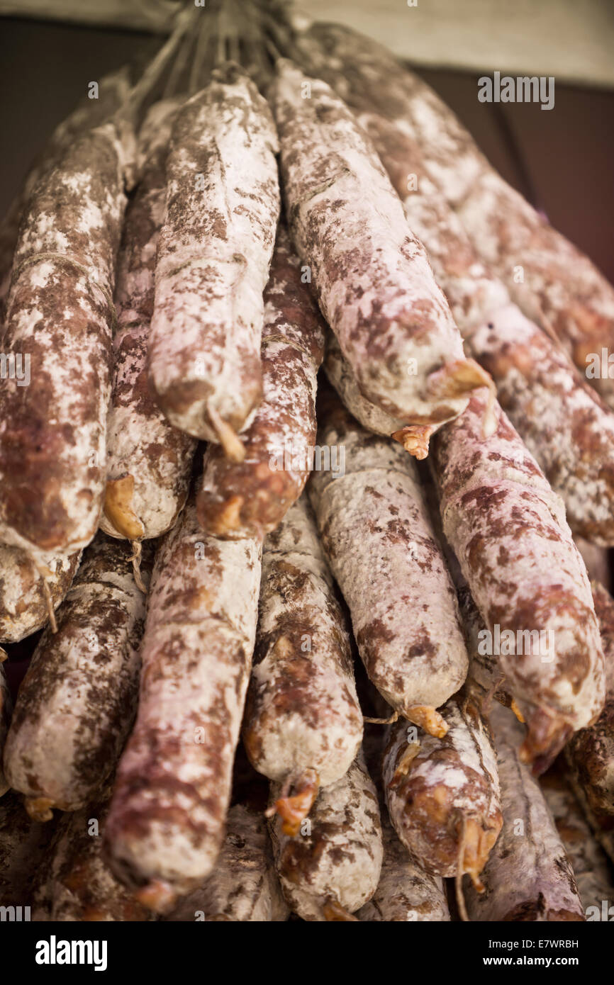 Home made sausages selling in a french market. Vertical filtered shot with selective focus Stock Photo