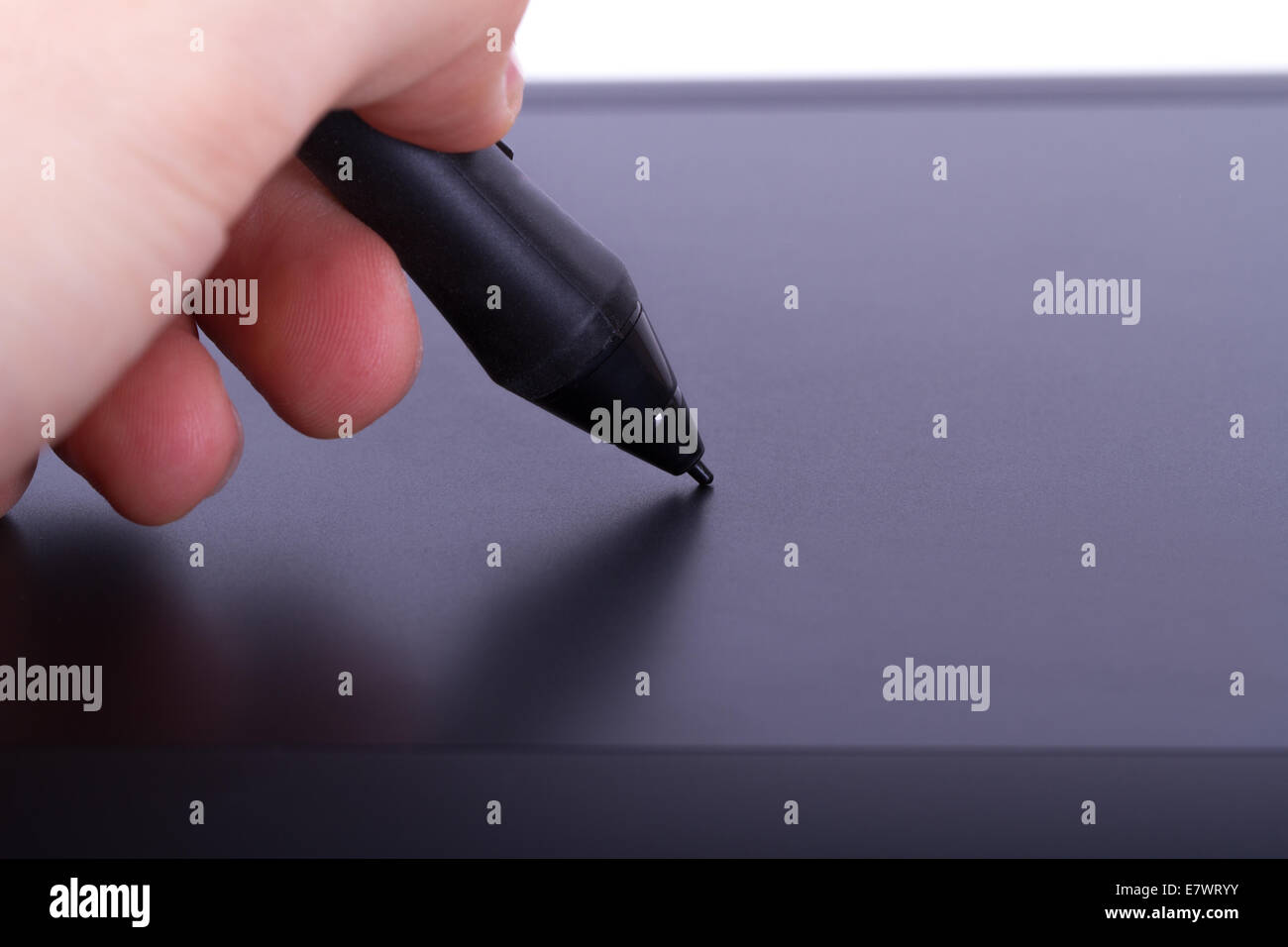 Illustrator drawing with digital pen on graphic tablet, isolated on