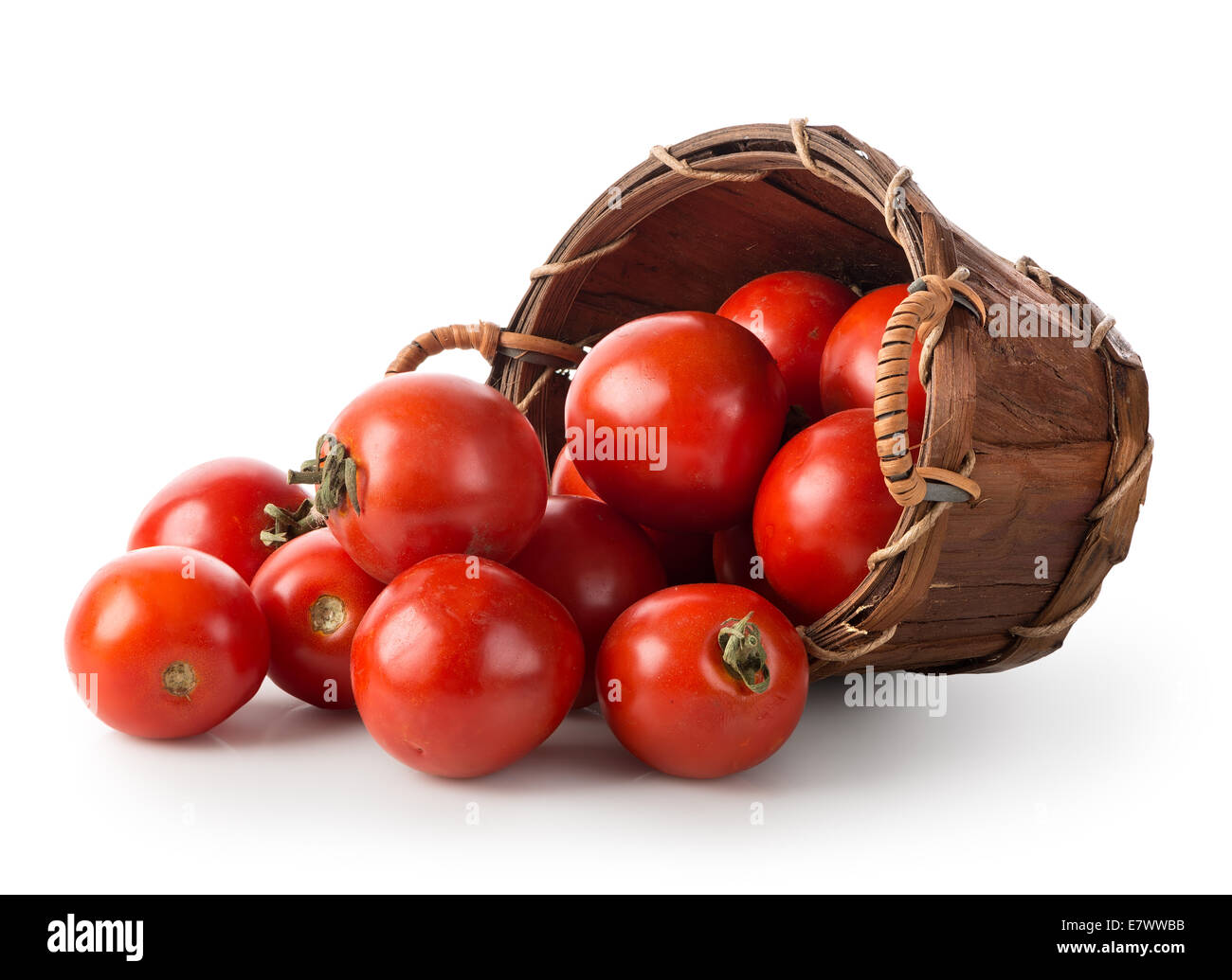 Tomatoes in a basket isolated on a white background Stock Photo - Alamy