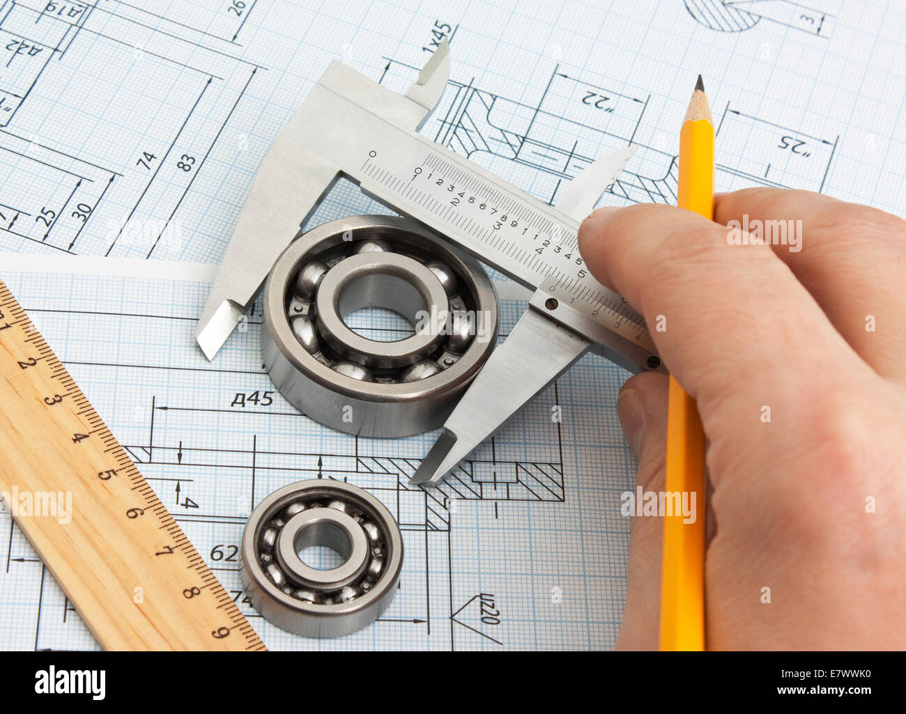 technical drawing and tools in hand Stock Photo