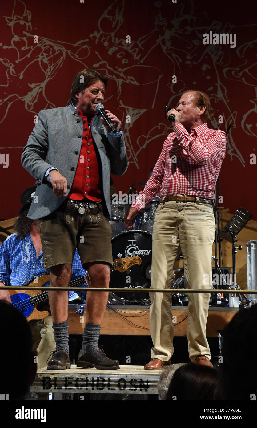 Munich, Germany. 24th Sep, 2014. Manager of Radio Gong, Georg Dingler (L)  and singer Michael Holm sing during the Radio Gong Wiesn in the Weinzelt  festival tent at Oktoberfest in Munich, Germany,