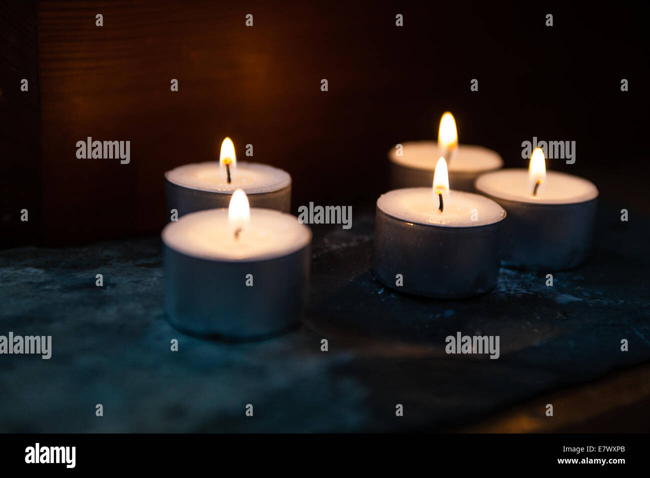Candles emit a warm glow on a Buddhist shrine Stock Photo Alamy