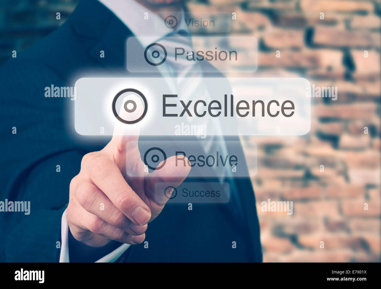 Businessman pressing a Excellence concept button. Instagram Styling Applied. Stock Photo
