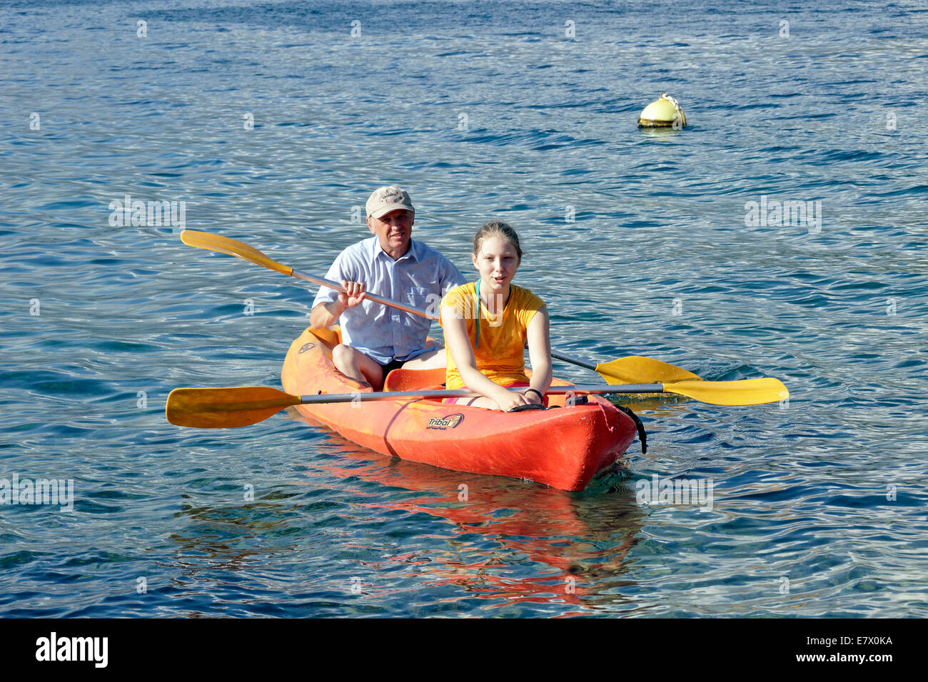 man and teenage girl in a canoe, Seveti Juraj, Kvarner Gulf, Croatia Stock Photo