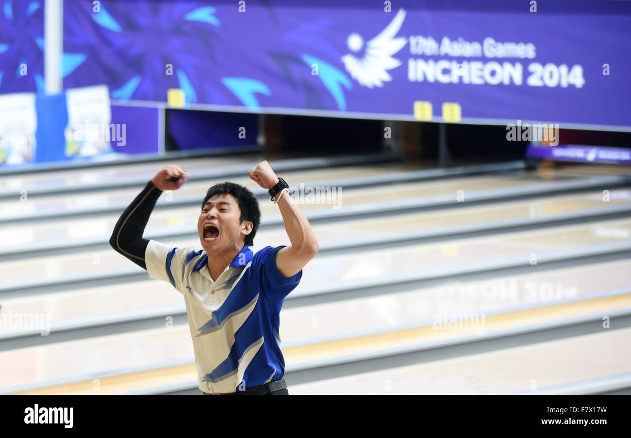 Incheon, South Korea. 25th Sep, 2014. Sasaki Tomoyuki of Japan celebrates after the men's doubles match of bowling at the 17th Asian Games in Incheon, South Korea, Sept. 25, 2014. Japan won the gold and silver medals, while Indonesia won the bronze medal. © Huang Zongzhi/Xinhua/Alamy Live News Stock Photo