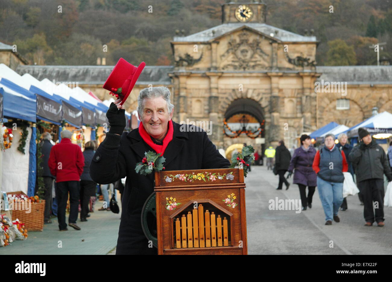 Organ grinder, Patrick Cooke entertains at Chatsworth Christmas Market, Chatsworth House, Peak District