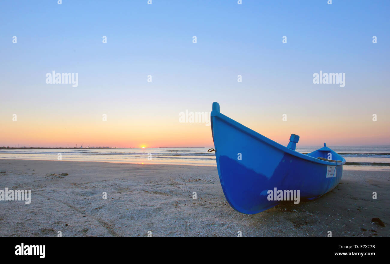 Fishing boat and sunrise on Black Sea beach Stock Photo - Alamy
