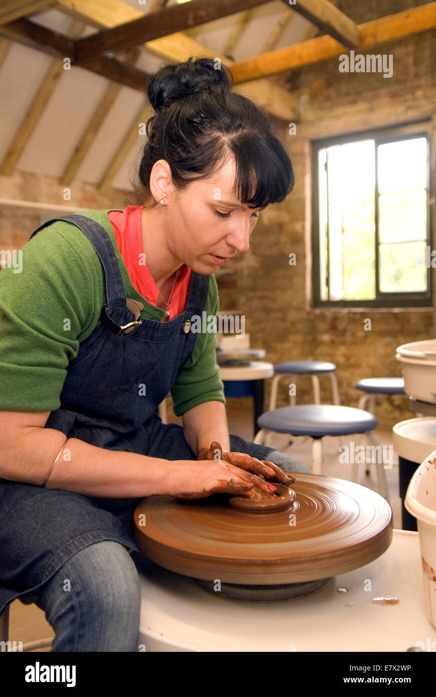 Pottery wheel girl hires stock photography and images Alamy