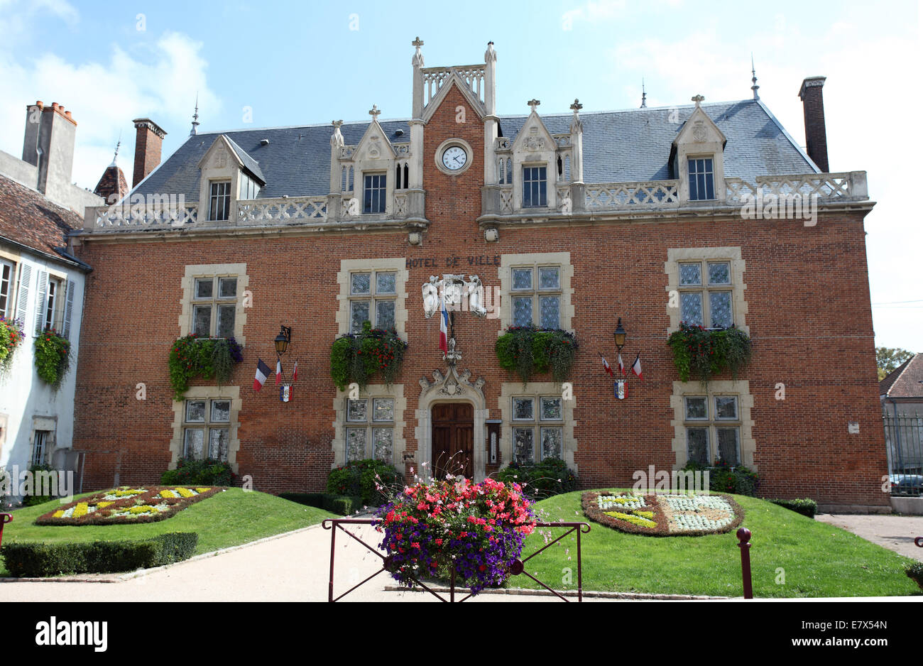 The red brick facade of the C15 Hotel de Ville of Auxonne, once the home of the dukes of Burgundy. Stock Photo