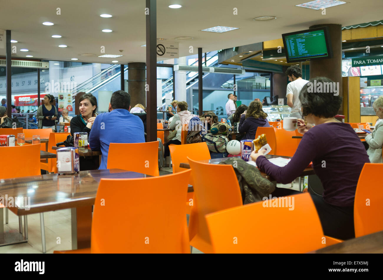 People at a cafeteria at Mendez Alvaro South Station, Madrid, Spain Stock Photo