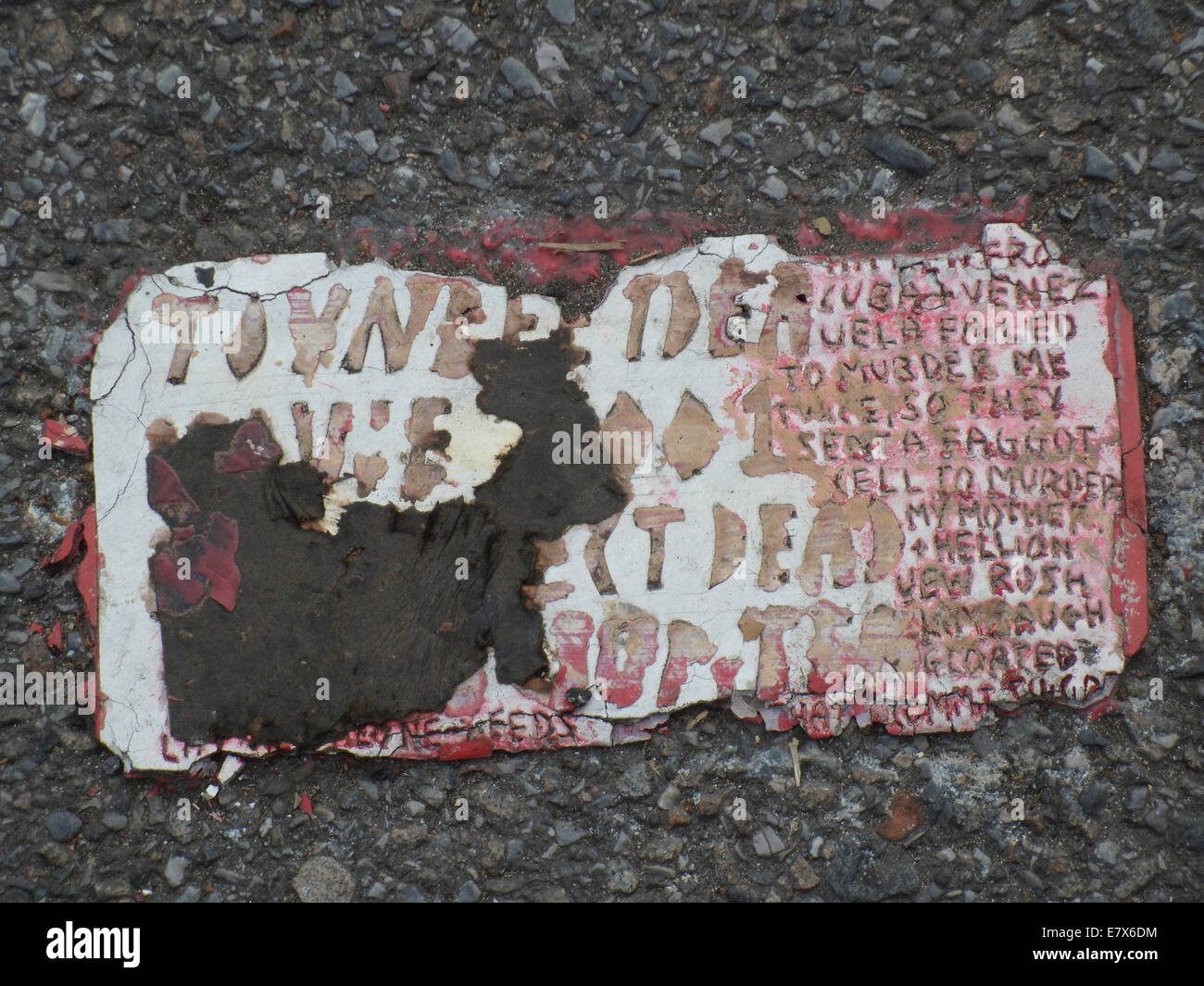 A Toynbee Tile is seen embedded into the pavement at a site in the Chelsea neighborhood of New York Stock Photo
