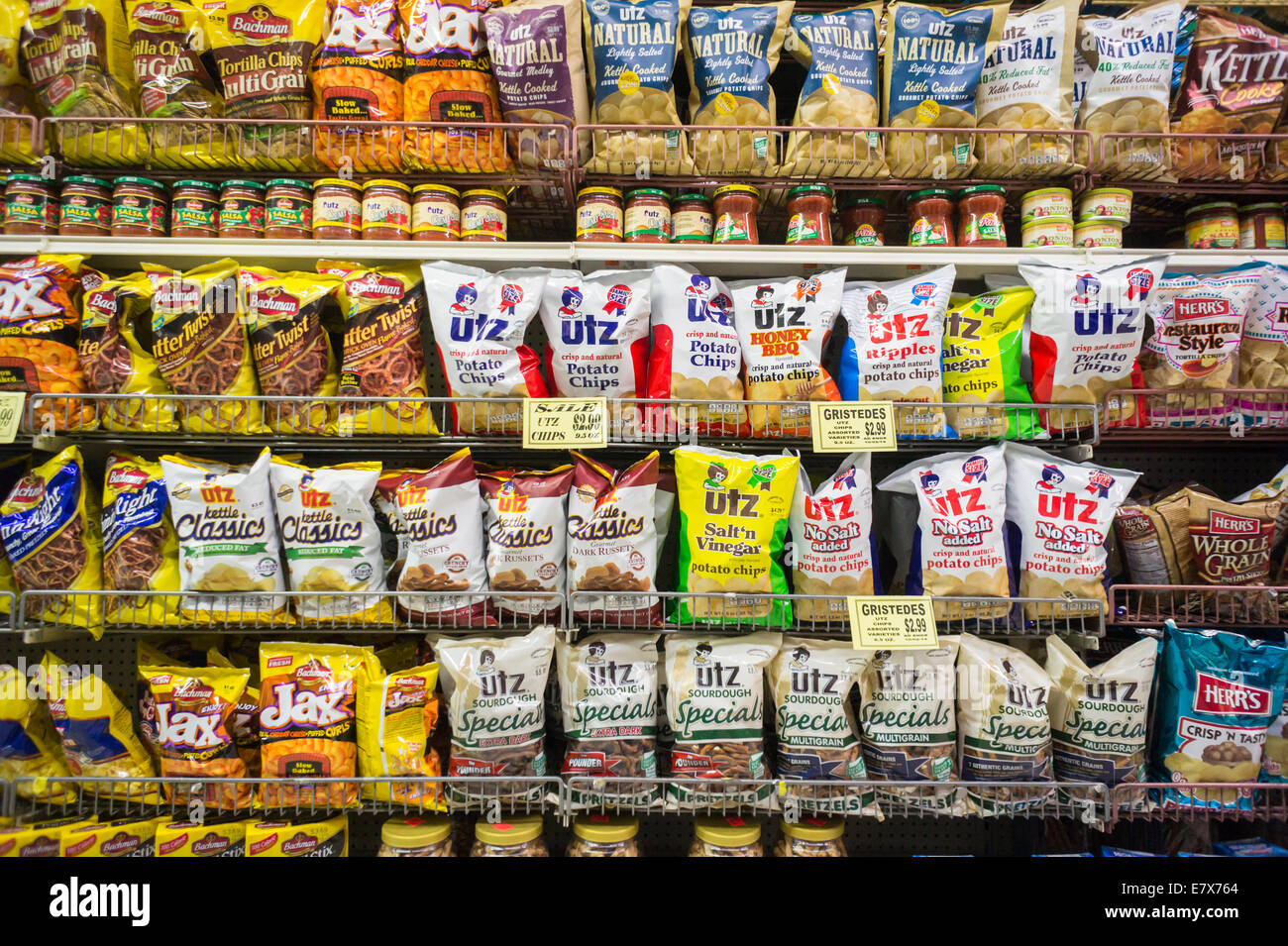 A display of tasty snacks including Utz brand products are seen in a supermarket in New York Stock Photo