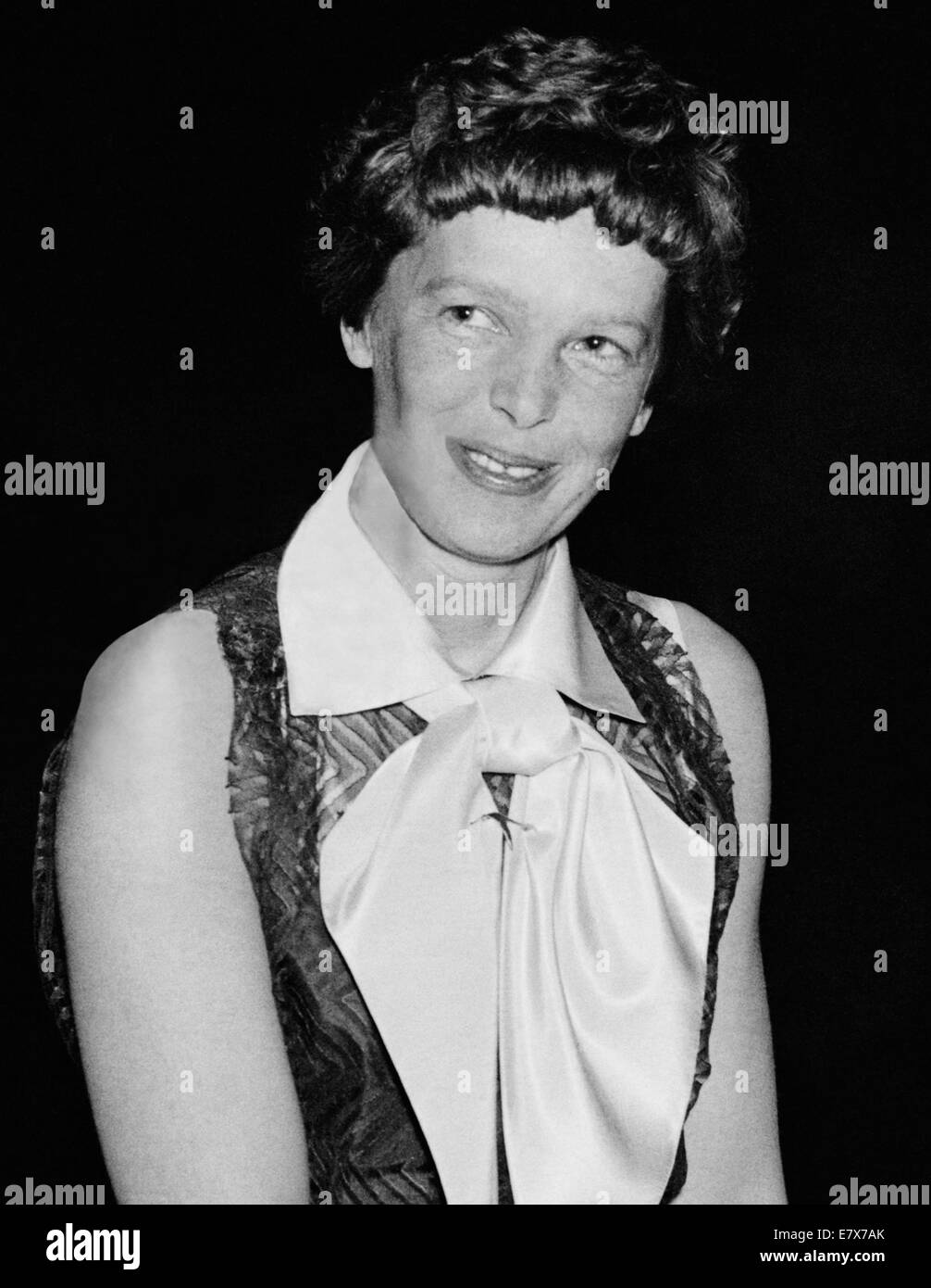 Vintage photo of American aviation pioneer and author Amelia Earhart (1897 – declared dead 1939) – Earhart and her navigator Fred Noonan famously vanished in 1937 while she was trying to become the first female to complete a circumnavigational flight of the globe. Photo by Harris & Ewing taken in 1935. Stock Photo