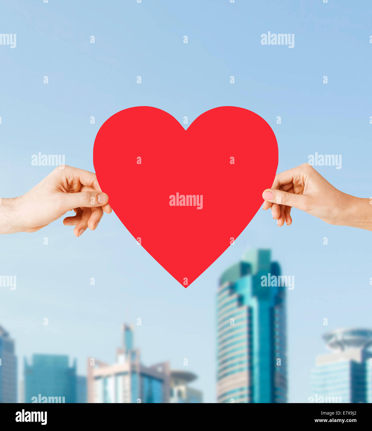 couple hands holding red heart Stock Photo - Alamy