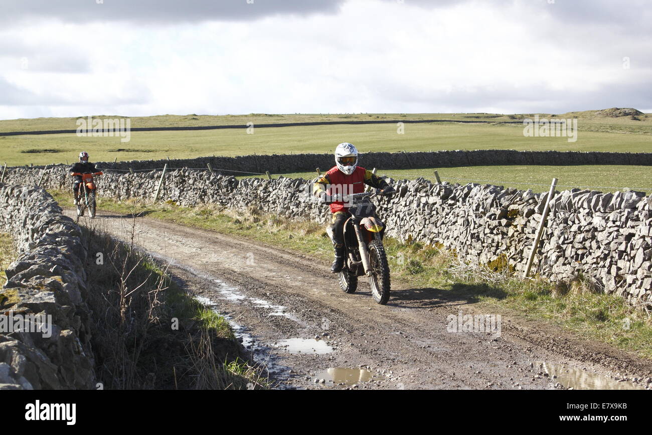 Off-road trail riders navigates a lane near Castleton in the Peak District National Park, Derbyshire UK Stock Photo