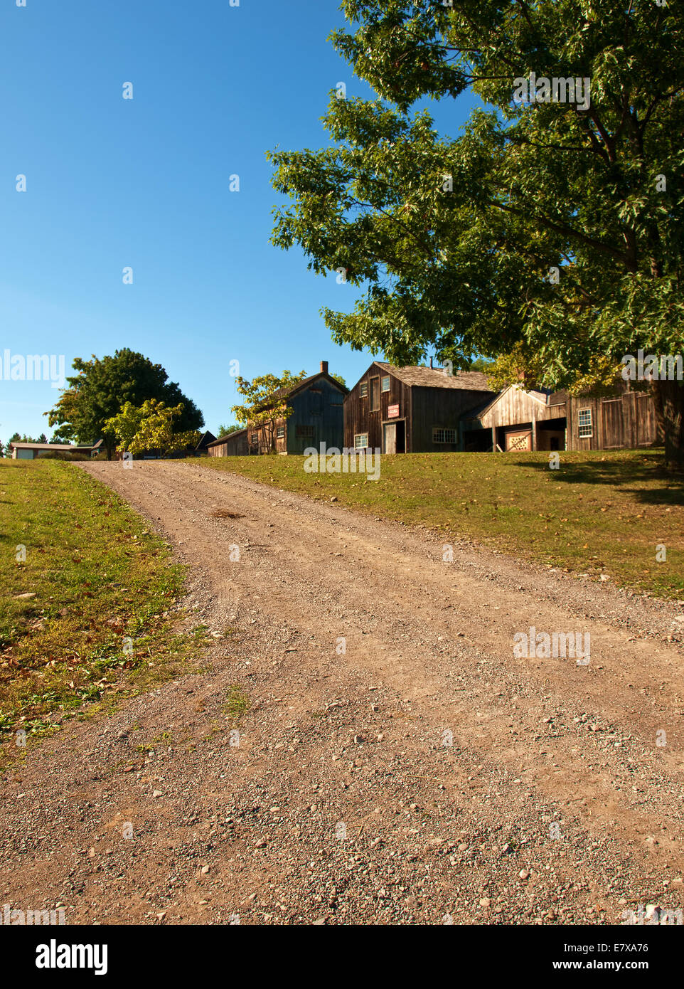 dirt road to a small rural town Stock Photo