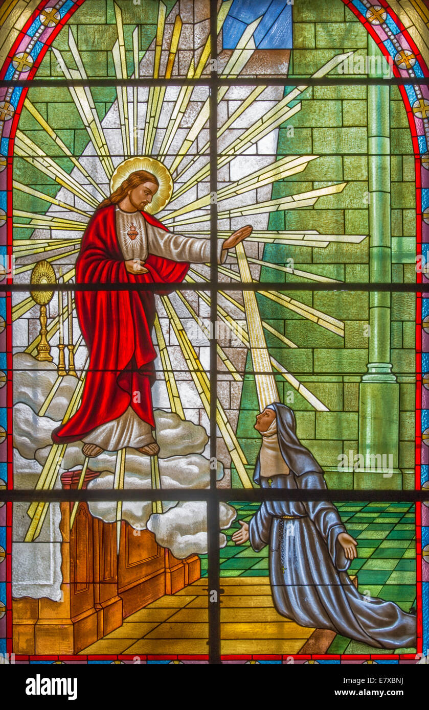ROZNAVA, SLOVAKIA - APRIL 19, 2014: The Windowpane with the scene of Jesus appearing to Saint Margaret Mary Alacoque Stock Photo