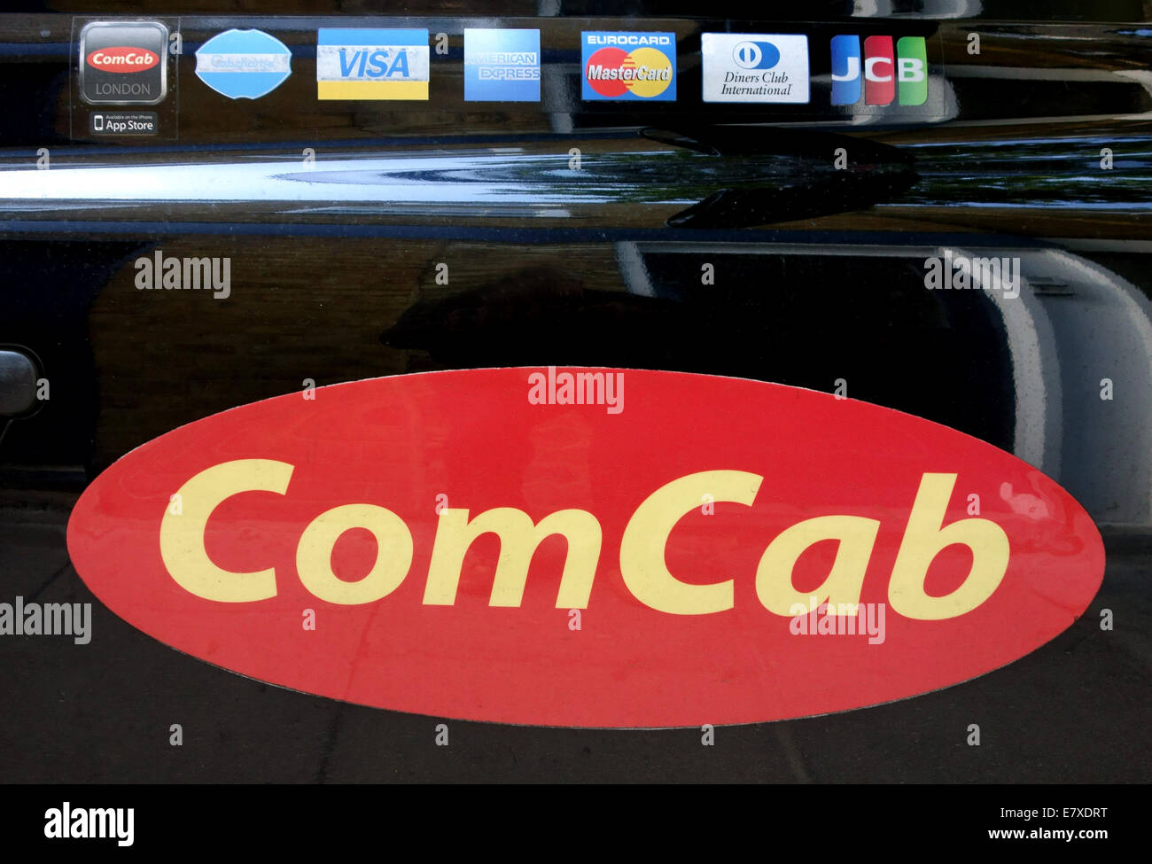 Logo and credit card signs on door of ComCab licensed taxi, London Stock Photo
