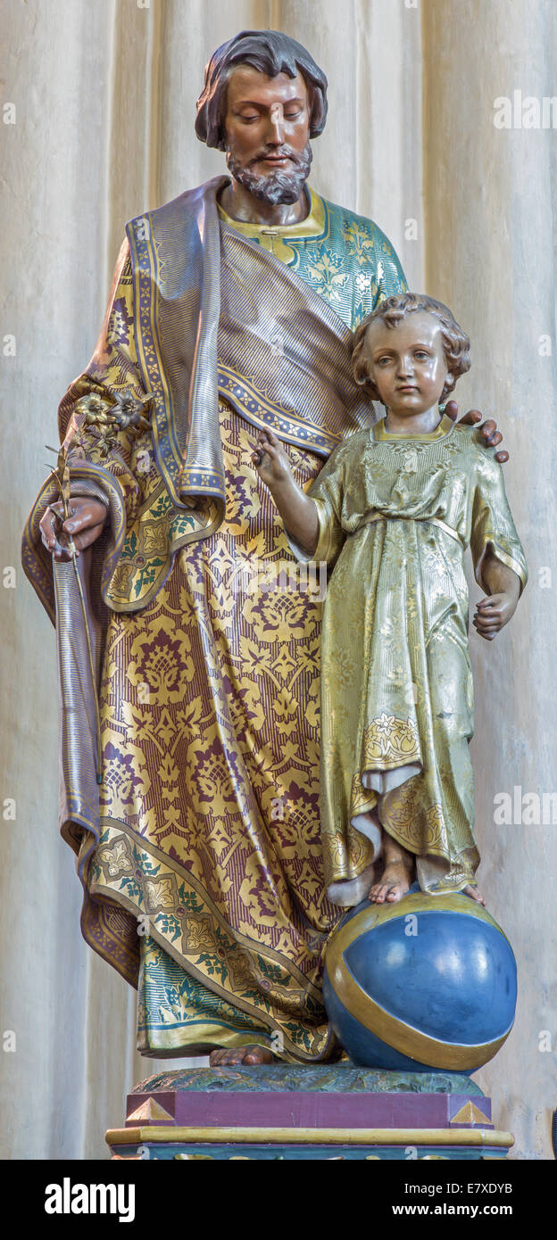 BRUGES, BELGIUM - JUNE 12, 2014: Carved polychrome statue of Holy Joseph  in the church Our Lady. Stock Photo
