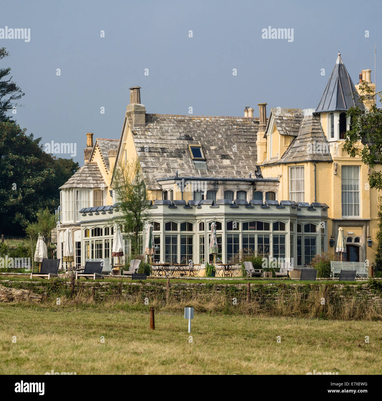 Old manor House converted to 'The Pig on the Beach' Hotel at Studland, Dorset, England, UK Stock Photo