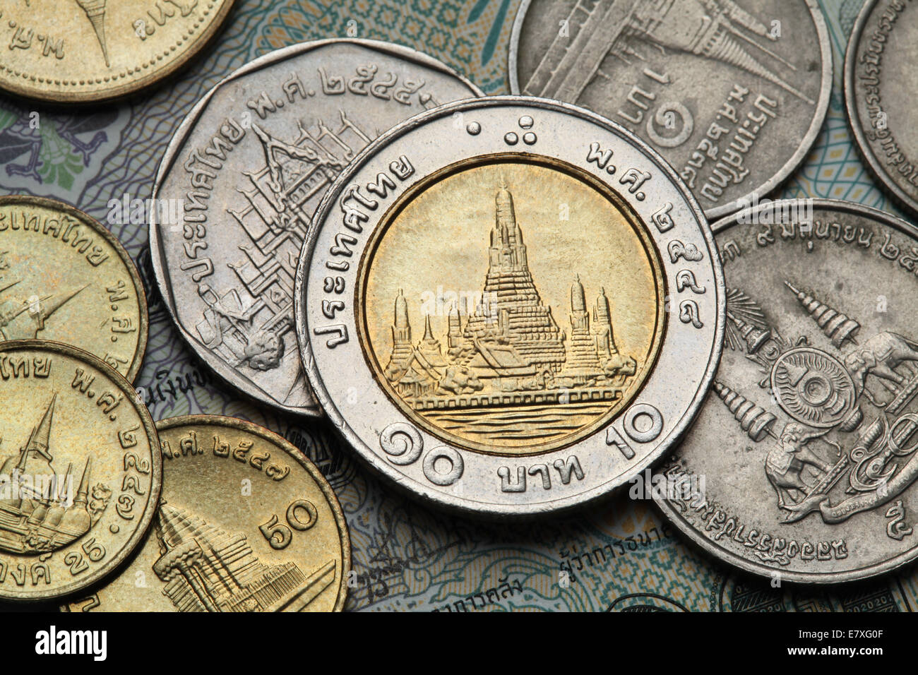 Coins of Thailand. Wat Arun Temple in Bangkok, Thailand, depicted in the Thai ten baht coin. Stock Photo