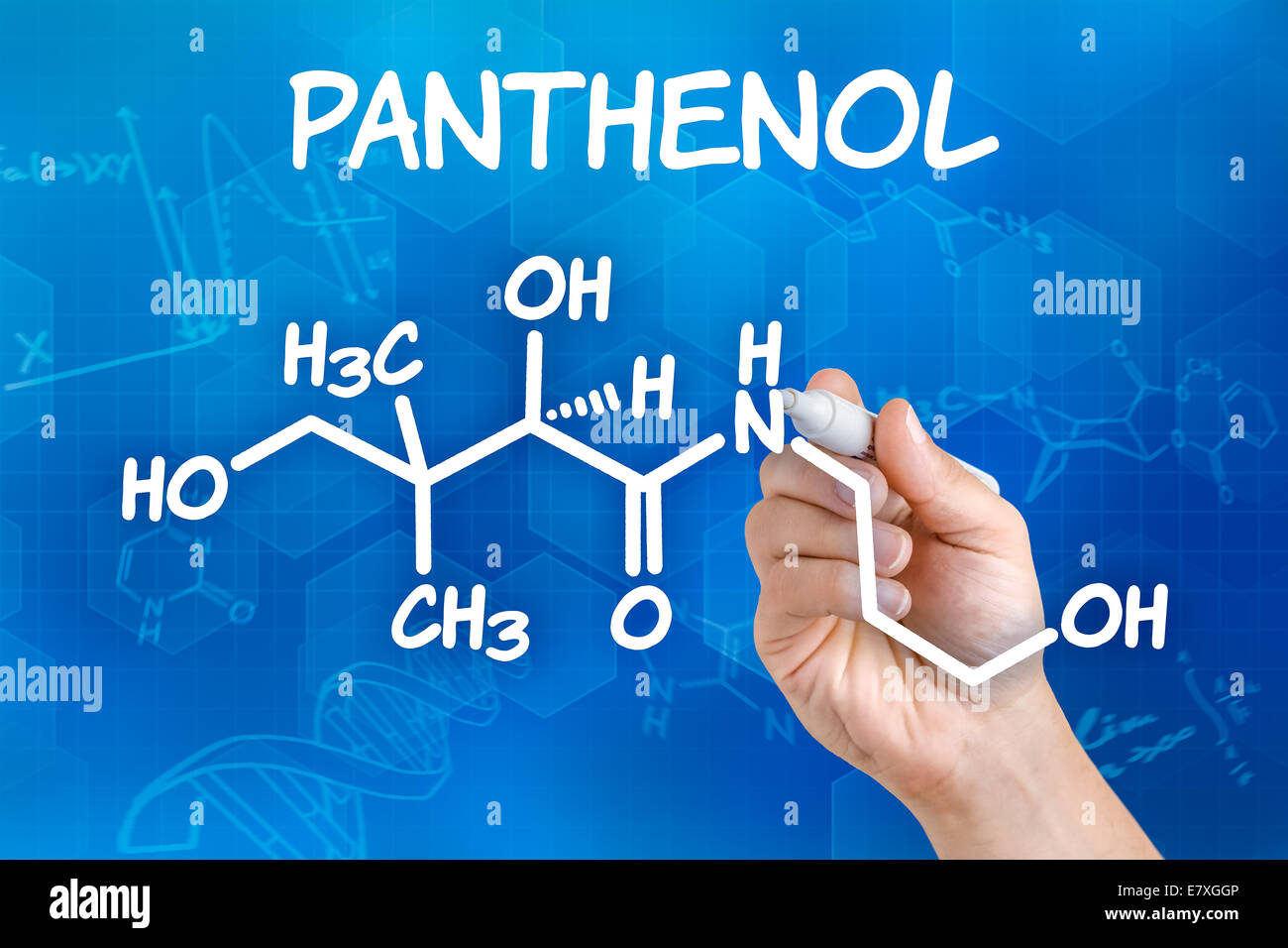 Hand with pen drawing the chemical formula of Panthenol Stock Photo