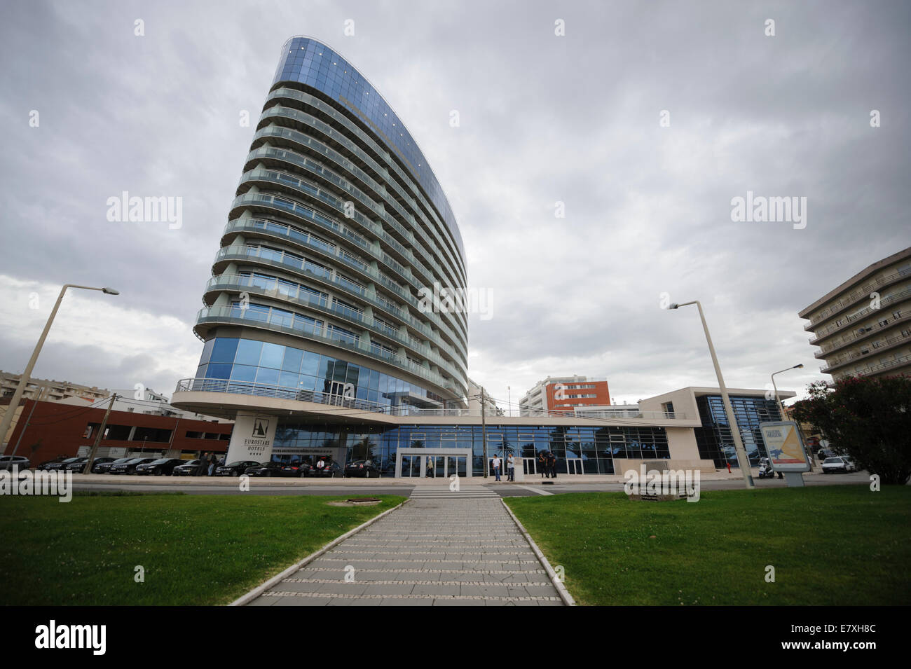 Building with modern architecture and curved glass balconies Stock Photo