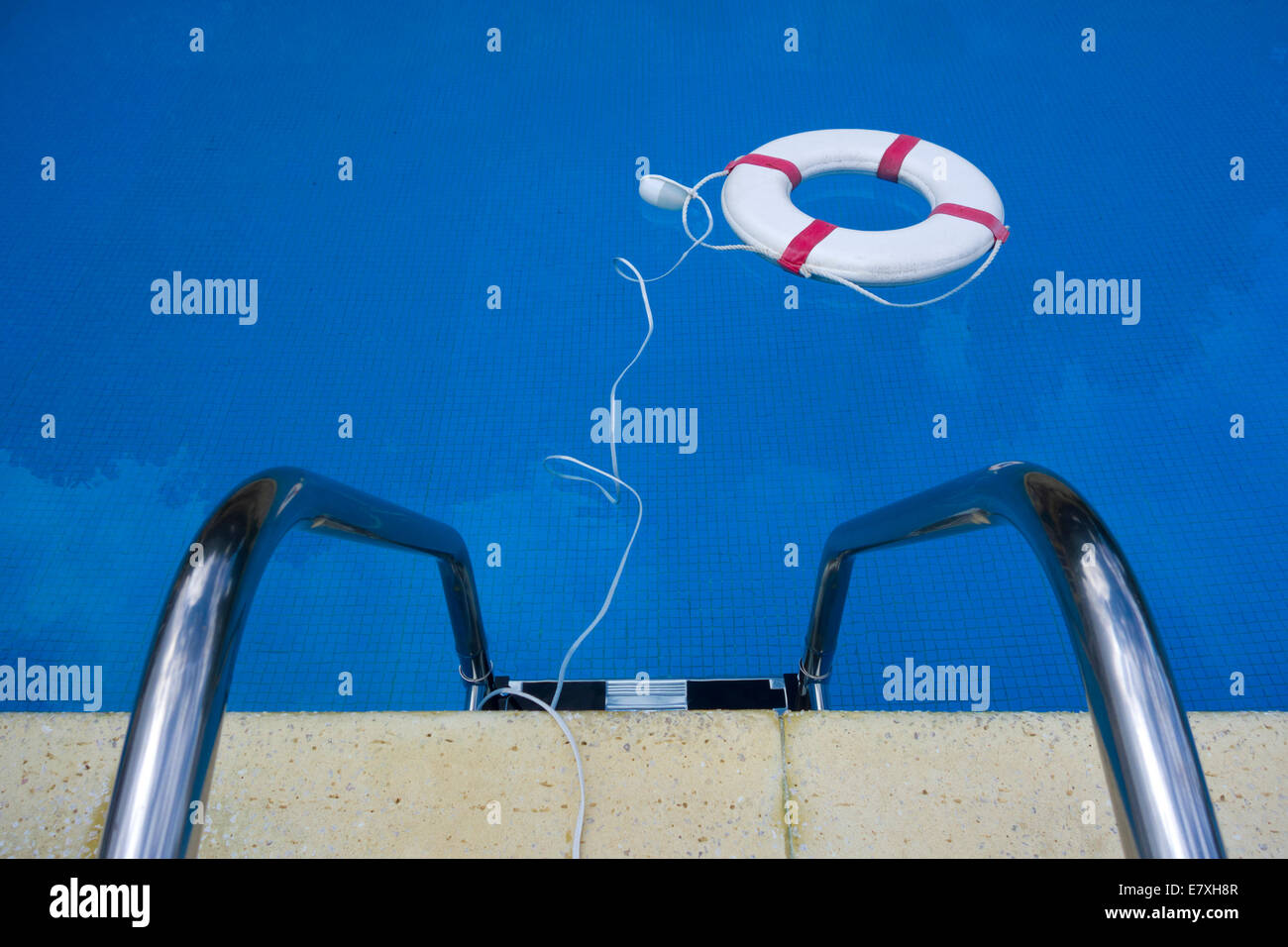 Lifebelt floating in a swimming pool Stock Photo