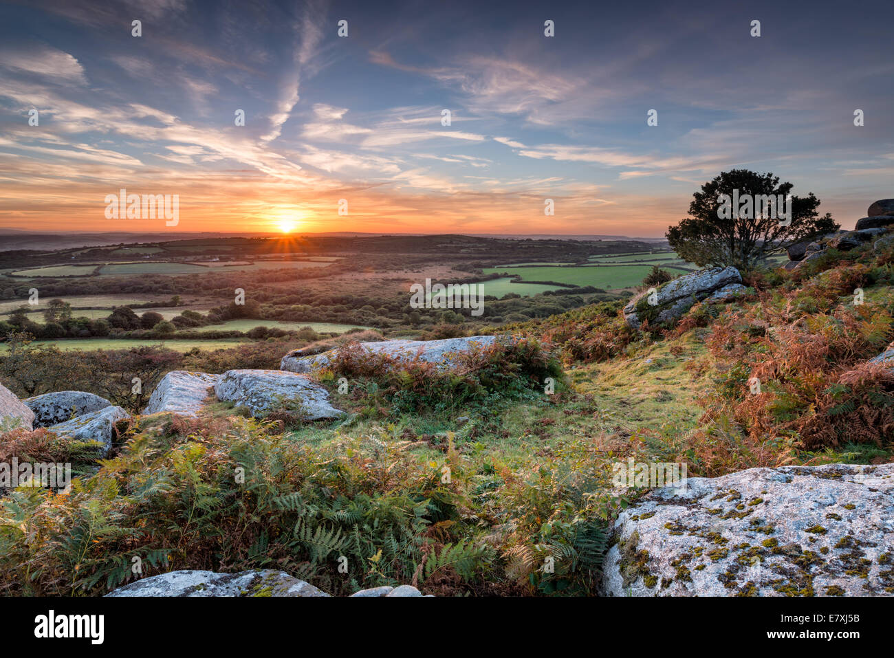A beautiful Autumn sunrise from Helman Tor a rocky outcrop of rugged ...